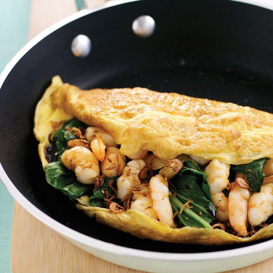 Omelette with garlic prawns and choy sum