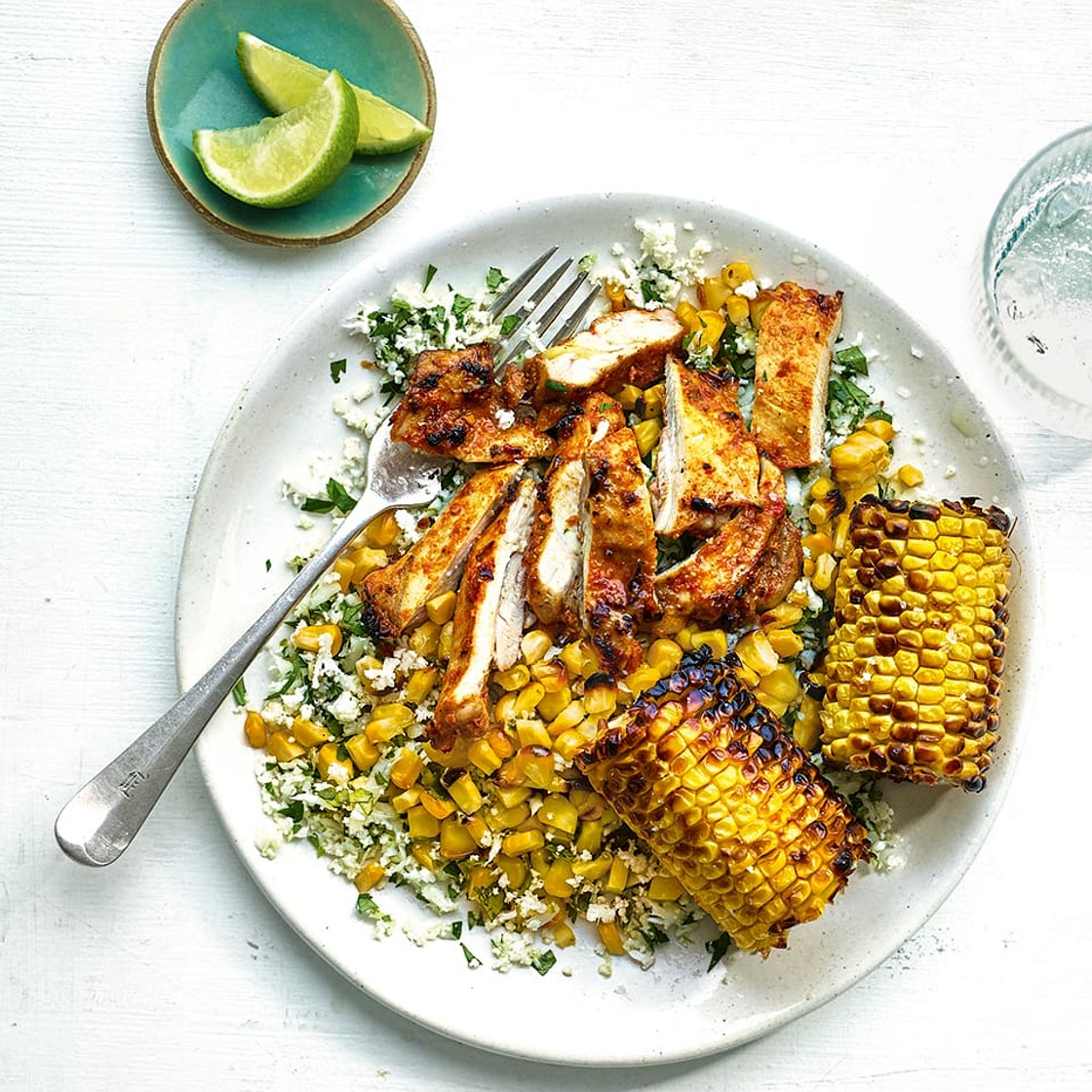 Peri-peri spiced chicken with cauliflower rice and charred corn cobs