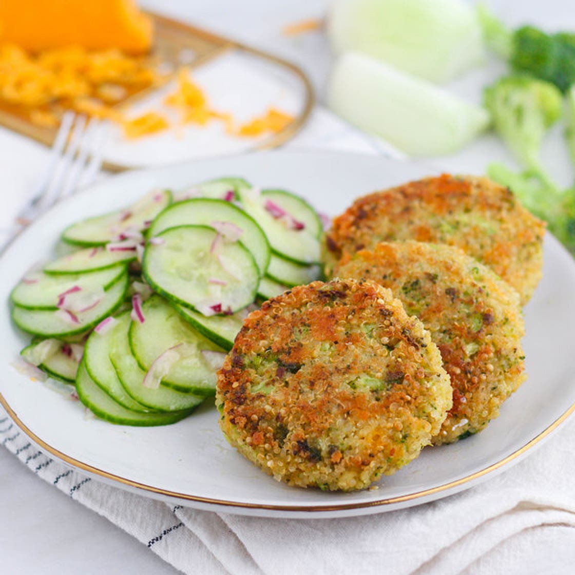 Cheesy Broccoli Quinoa Patties with Tangy Cucumber Salad