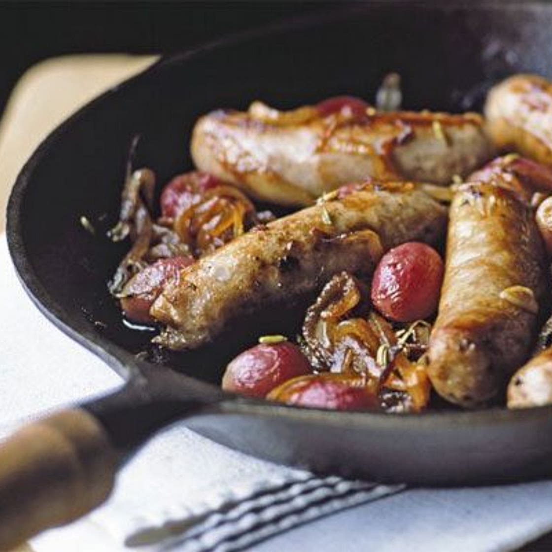 Sticky pan-roasted sausages with grapes