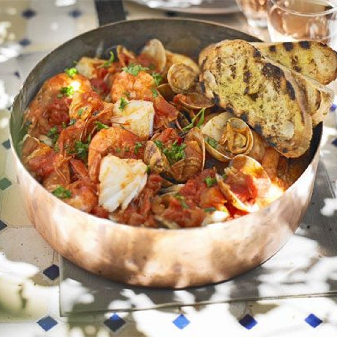 Mediterranean fish stew with garlic toasts