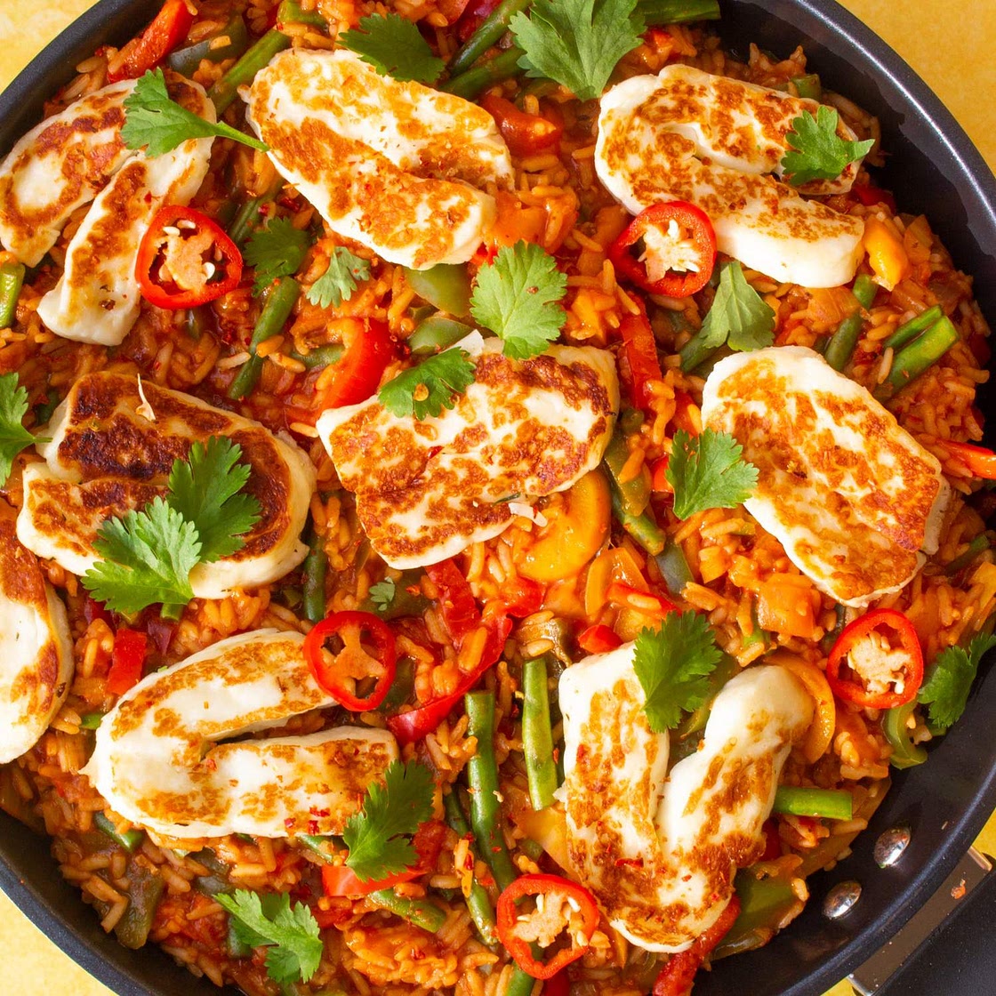 Spicy Tomato Rice topped with Halloumi and Coriander