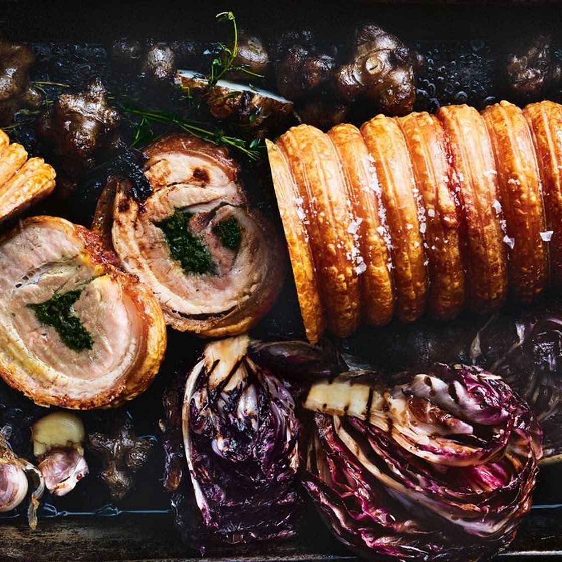 Herb and garlic porchetta with roast winter vegetables