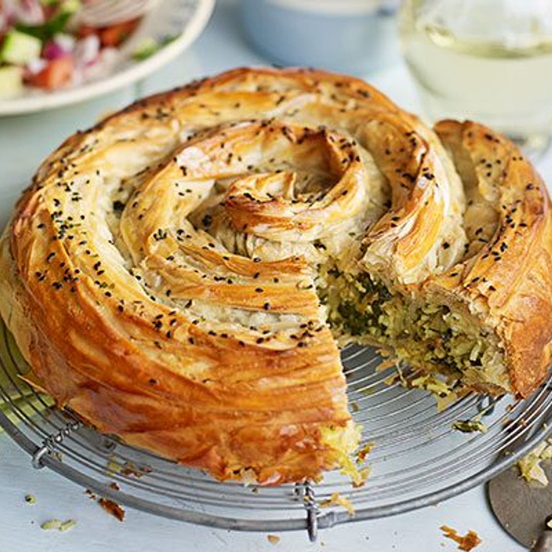 Veggie spiral pie with spiced tomato sauce & chopped salad