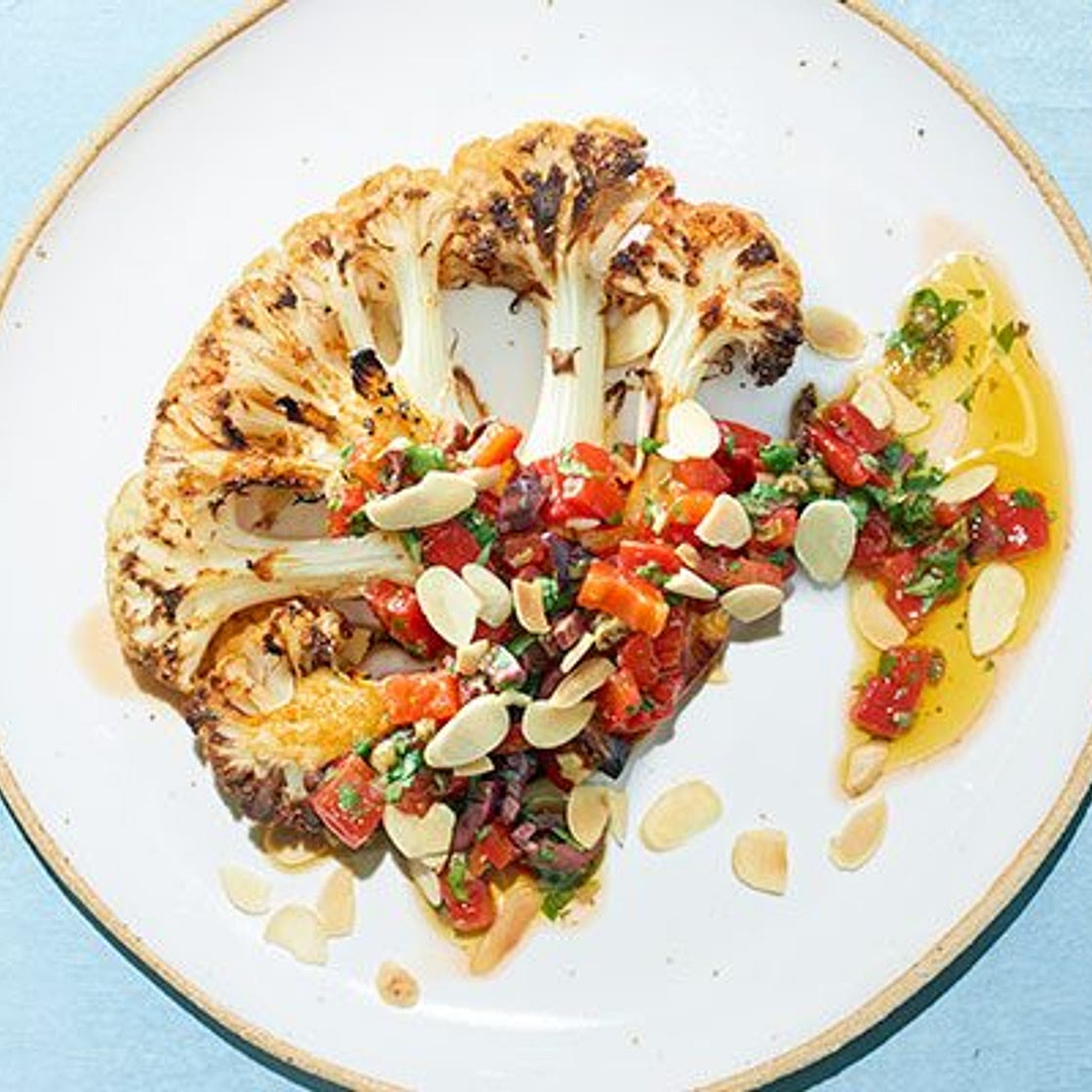 Cauliflower steaks with roasted red pepper & olive salsa