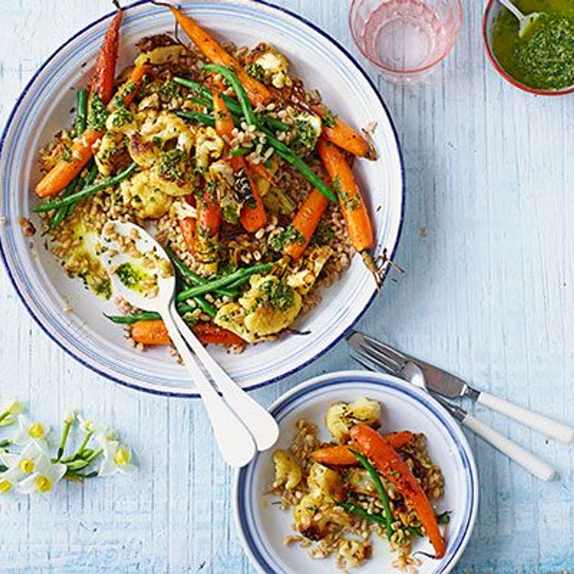 Roasted new carrots, cauliflower, grains & carrot-top dressing