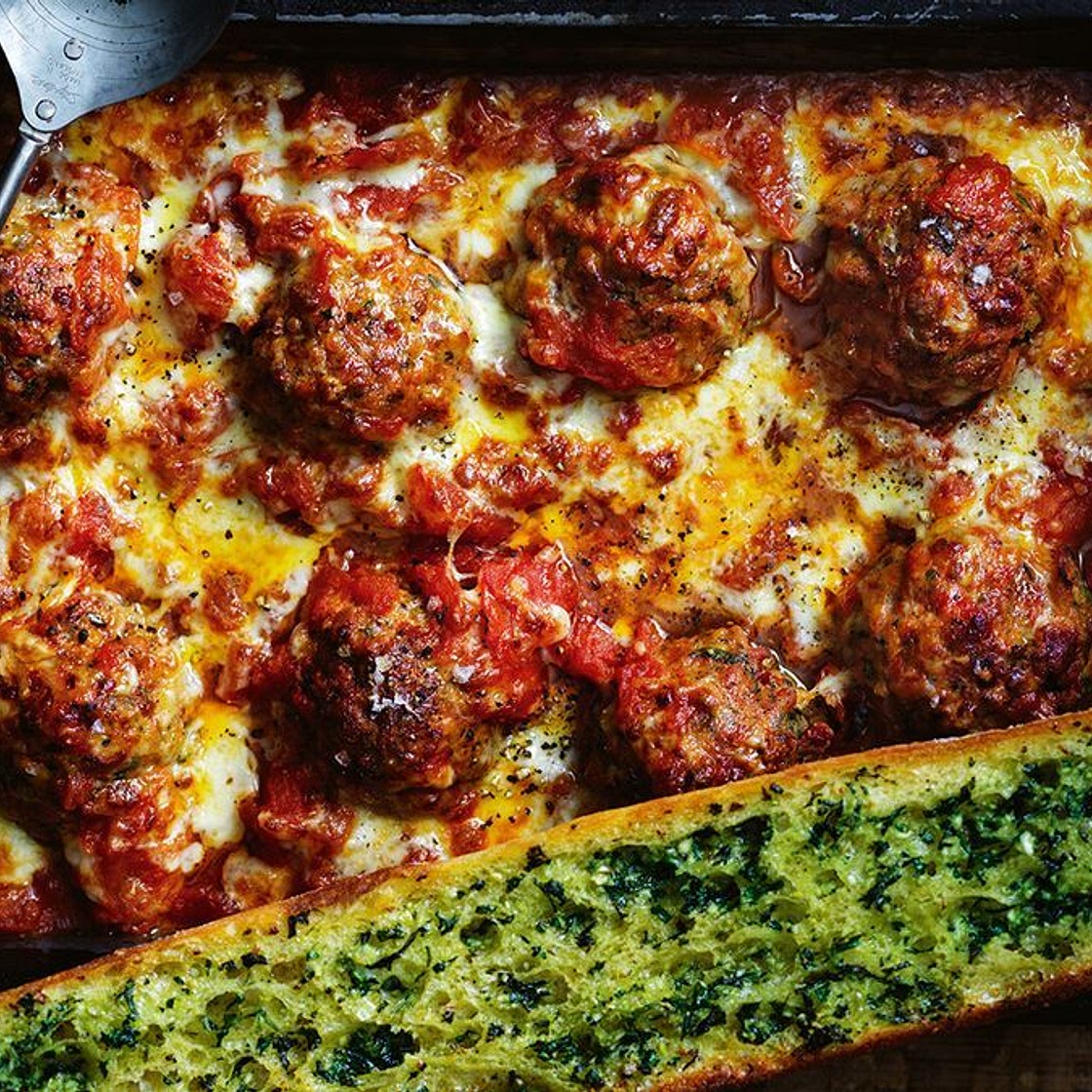 Oven-roasted chorizo meatballs with tomato ragu and herby garlic bread