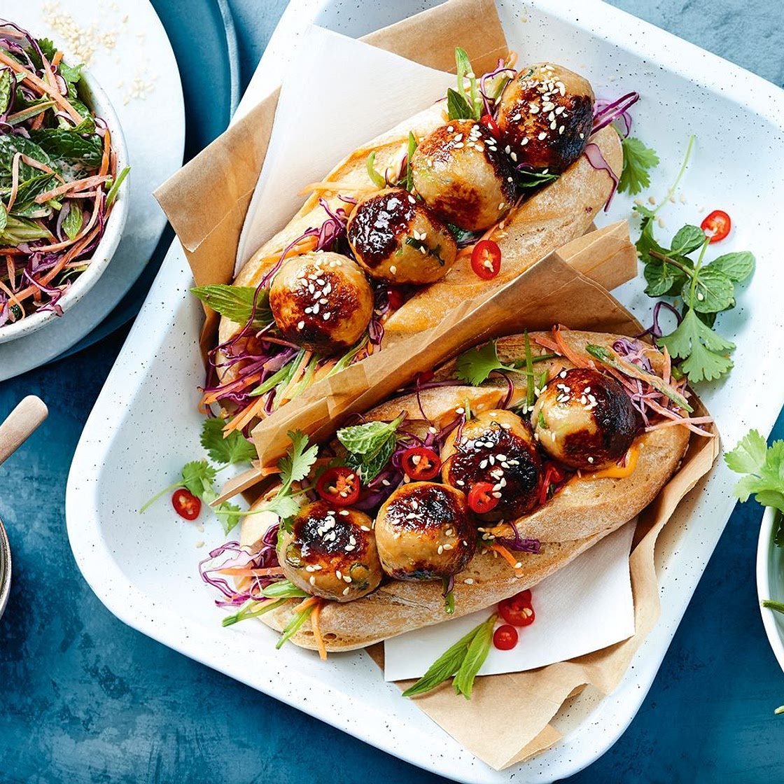 Honey-glazed miso chicken meatball subs with rainbow slaw