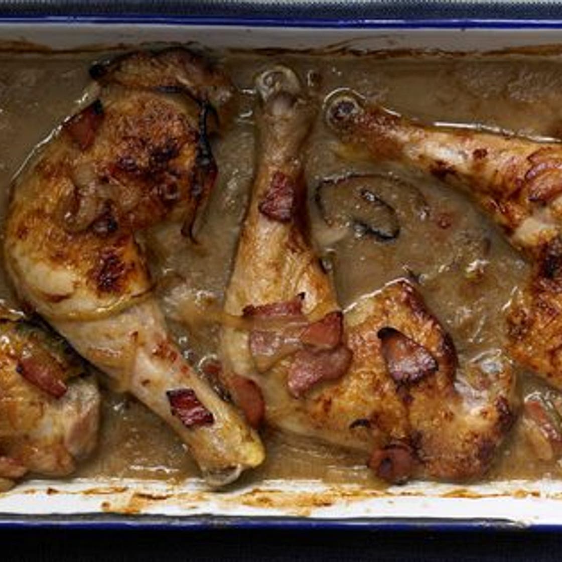 Chicken braised with cider and bacon