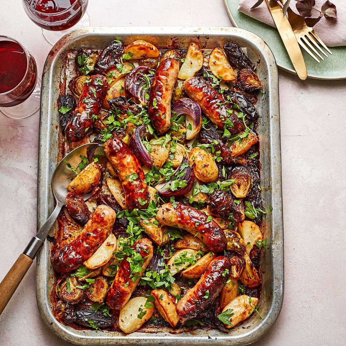 Sticky date and sausage traybake