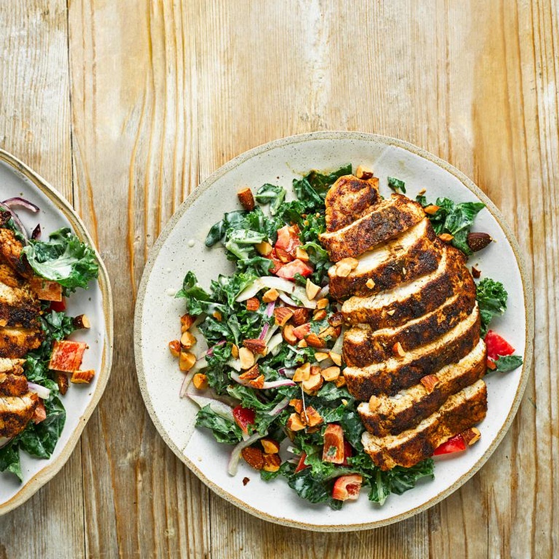 Cumin-crusted chicken with kale salad and hummus dressing