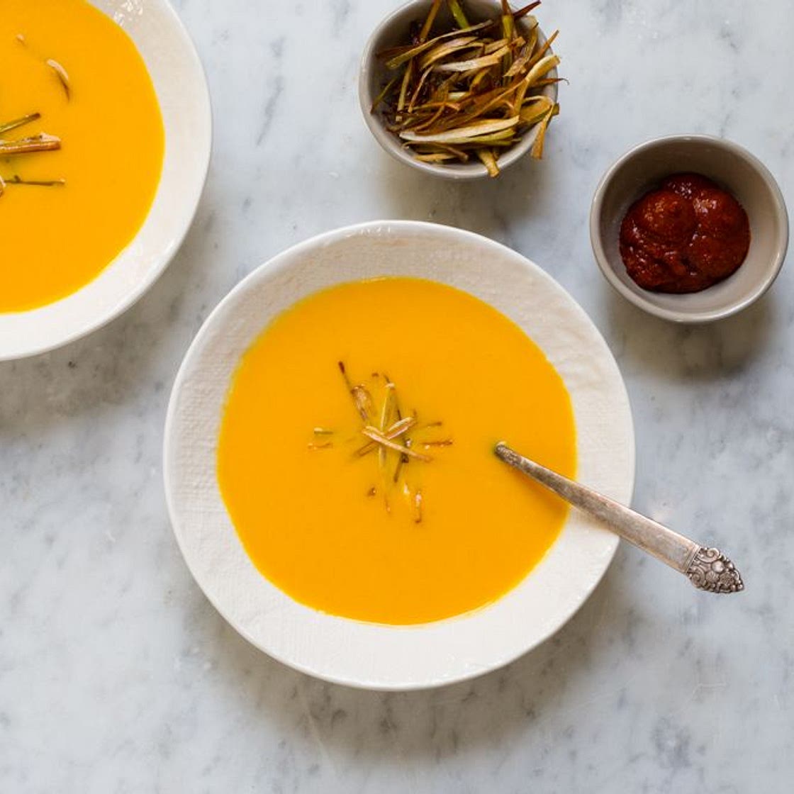 Carrot-Coconut Soup with Harissa and Crispy Leeks
