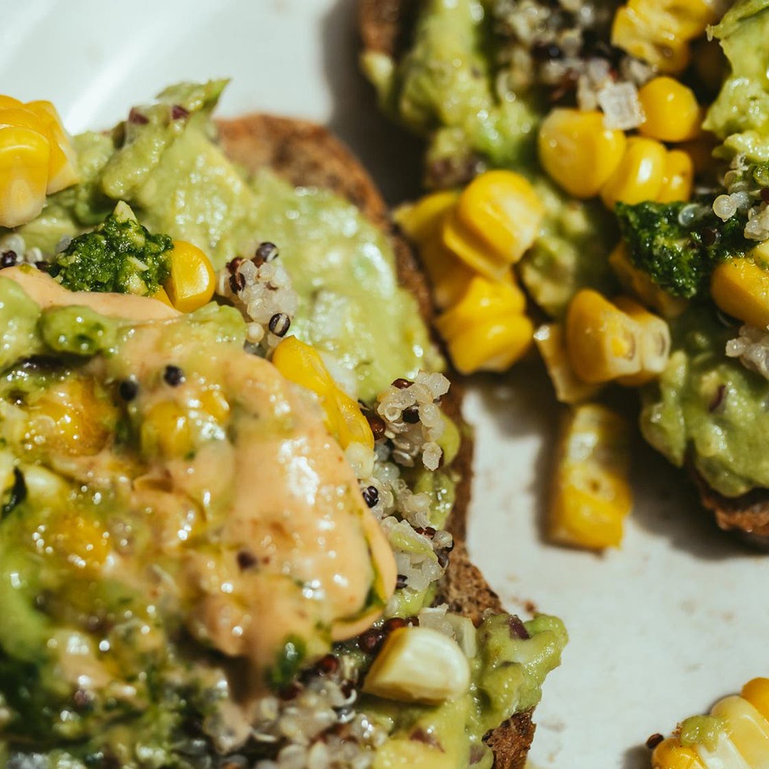 Avocado on toast with quinoa, maize and pesto