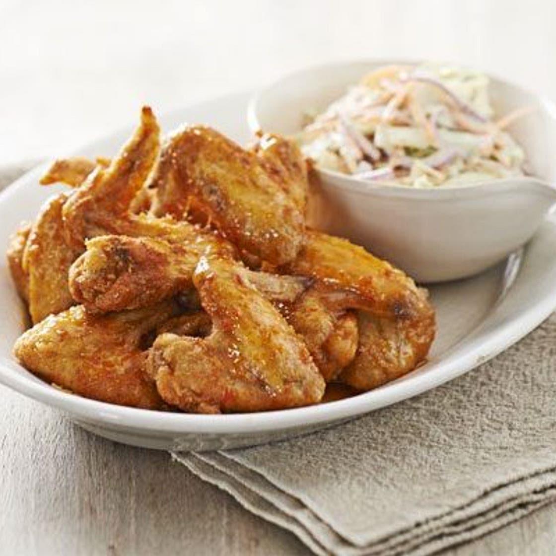 Crispy honey buffalo wings with blue cheese & celery slaw