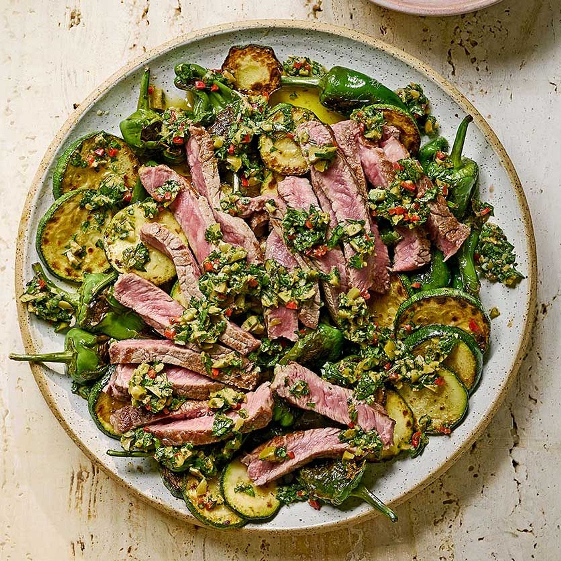 Olive chimichurri steak with padron peppers