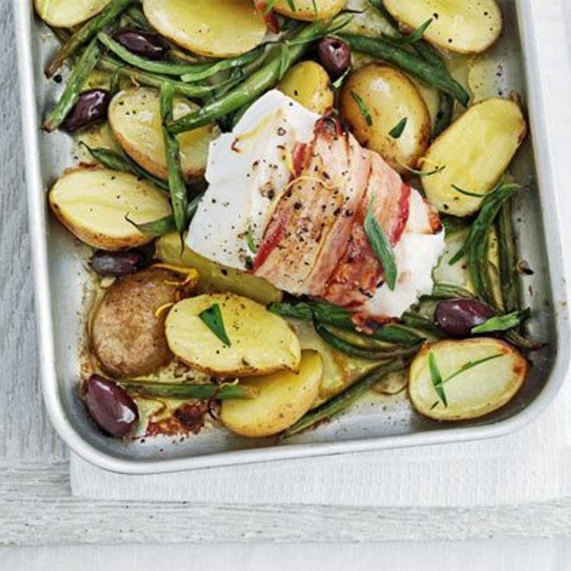 Pancetta-wrapped fish with lemony potatoes