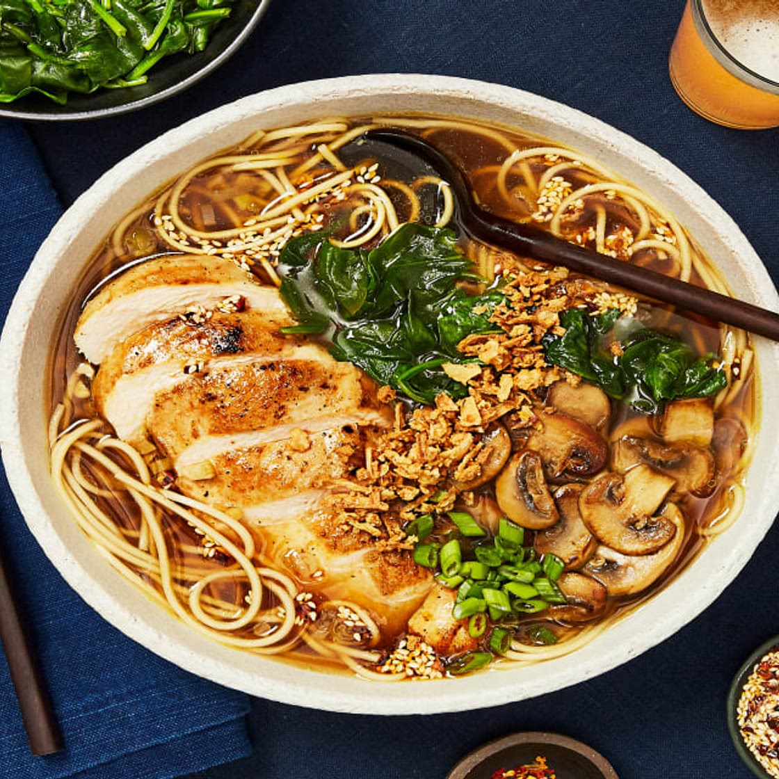 Chicken Ramen in a Shoyu-Style Broth with Mushrooms, Chili Garlic Oil & Crispy Onions