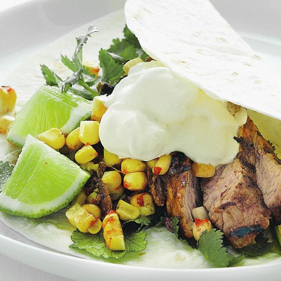 Chargrilled pork tortillas with charred chilli corn