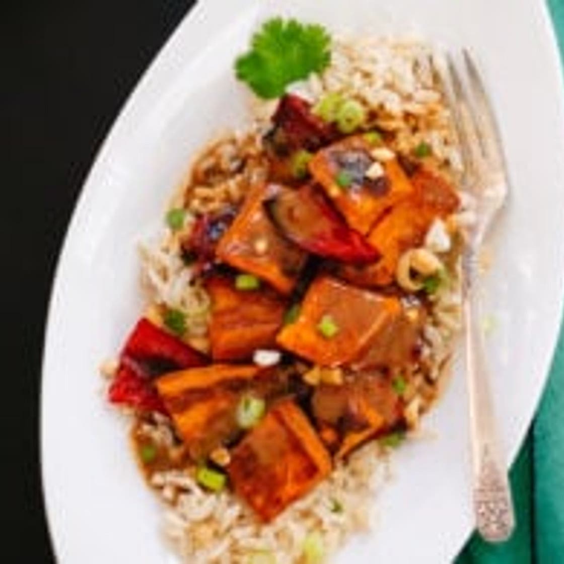 Spicy Thai Peanut Sauce over Roasted Sweet Potatoes and Rice