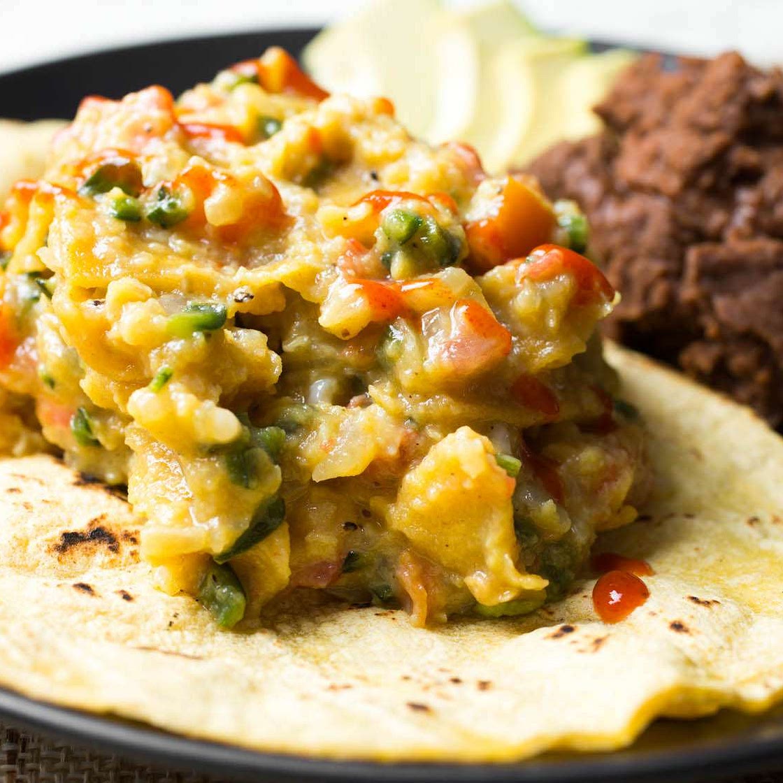 Tex-Mex Migas With Scrambled Eggs, Tortilla Chips, and Chilies Recipe