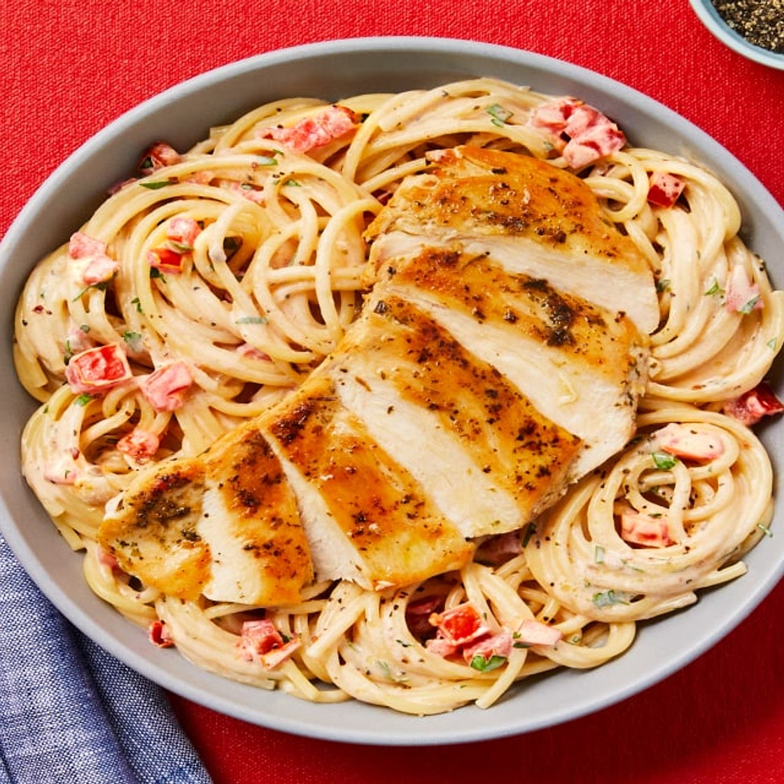 Creamy Aglio E Olio Chicken Pasta with Chili Flakes, Roma Tomato & Chopped Parsley