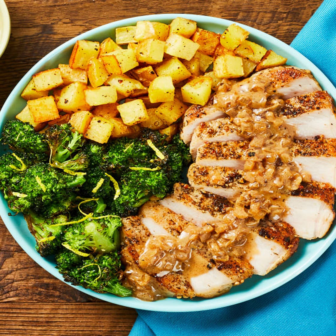 Steakhouse-Style Pork Chops with a Creamy Pan Sauce, Roasted Potatoes & Lemony Broccoli