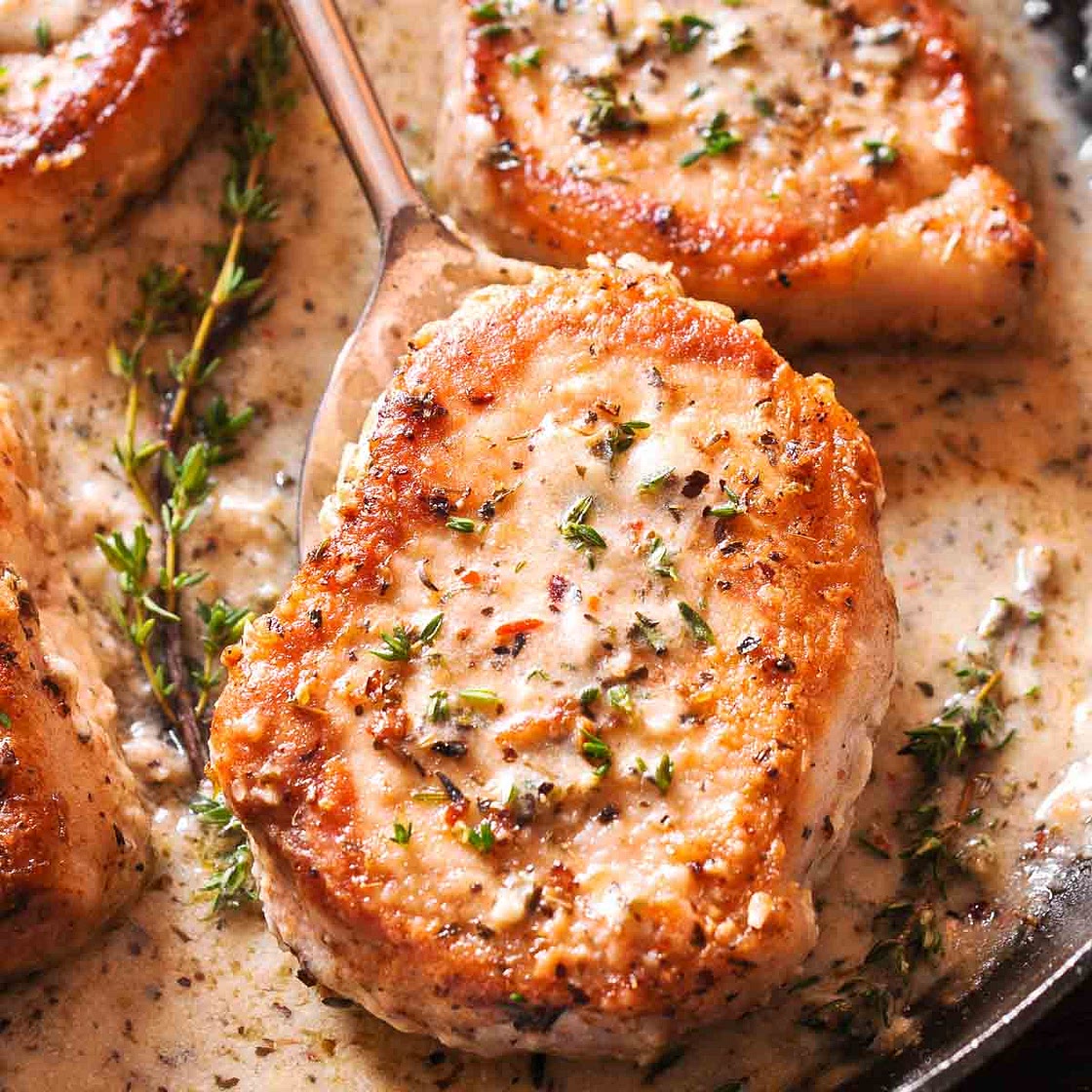 Boneless Pork Chops in Creamy Garlic and Herb Wine Sauce