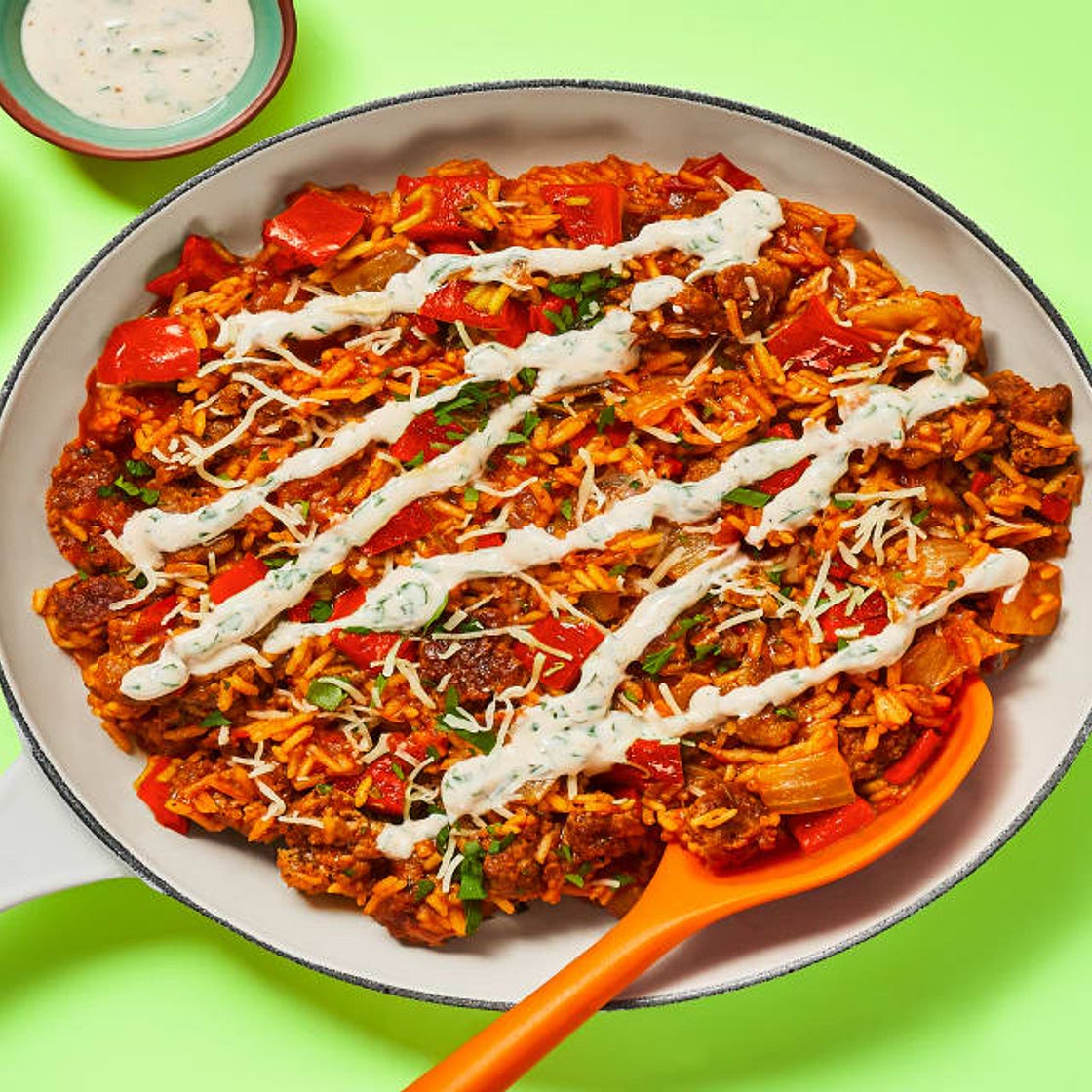 One-Pan Cajun Pork Sausage Skillet with Dirty Rice & Parsley Crema