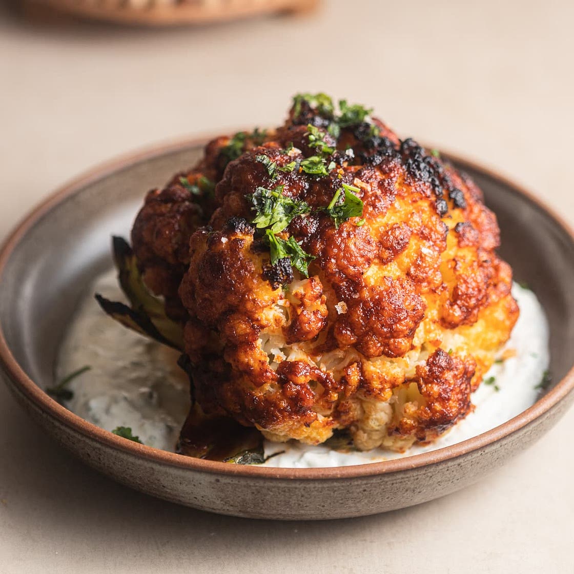 Whole-Roasted Harissa Cauliflower with Garlic Yogurt