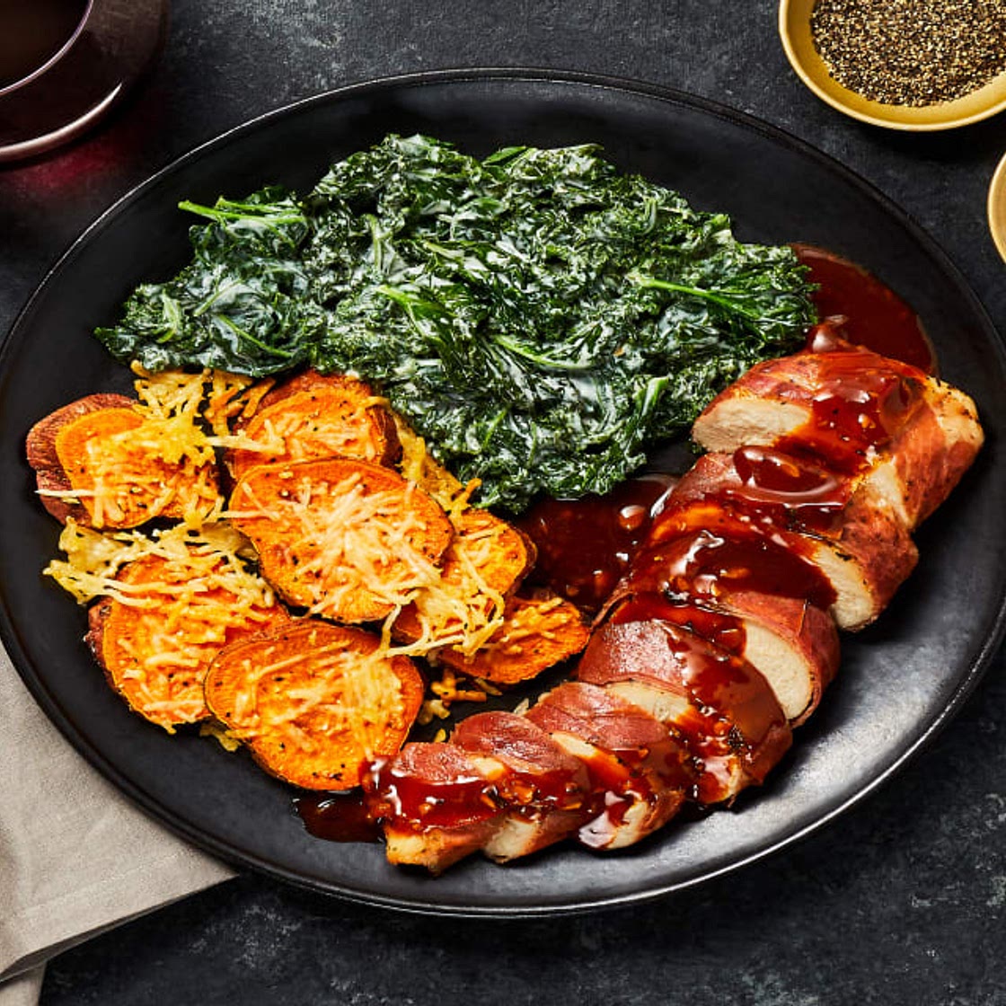 Garlic Dijon Prosciutto-Wrapped Chicken with Creamed Kale & Parmesan Shingled Sweet Potatoes
