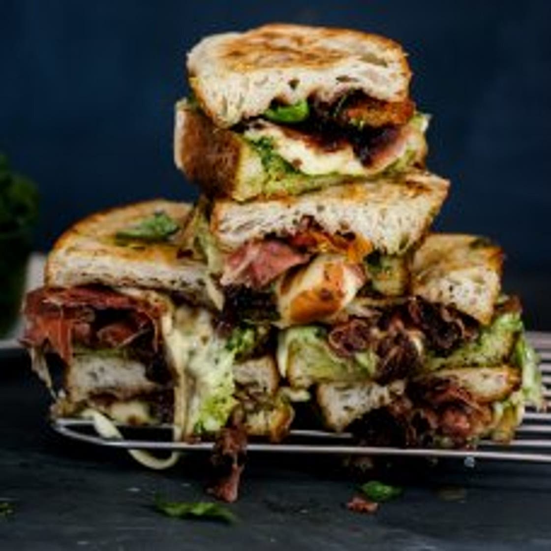 Loaded caprese toasties with pesto, onion jam and serrano ham