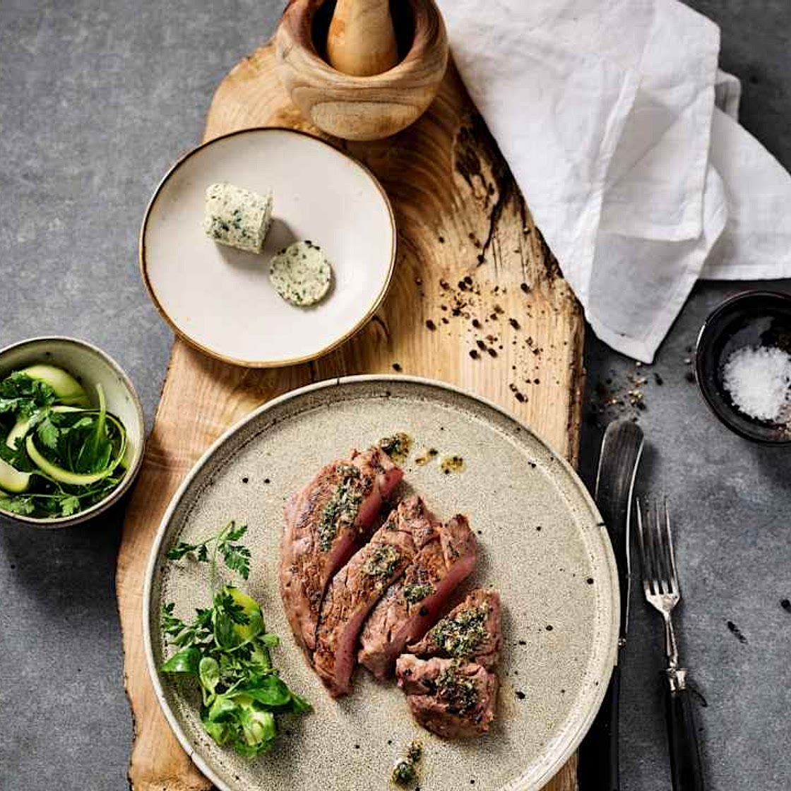 Rare beef steak with herb garlic butter