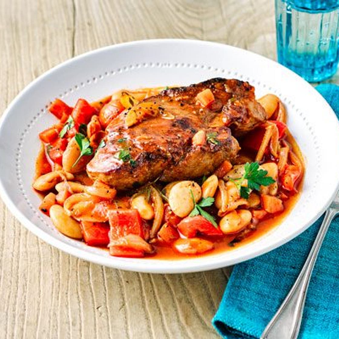 Spanish pork shoulder steaks with beans