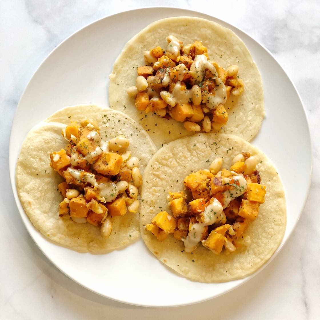 Sweet Potato and White Bean Tacos with Tahini Lemon Dressing