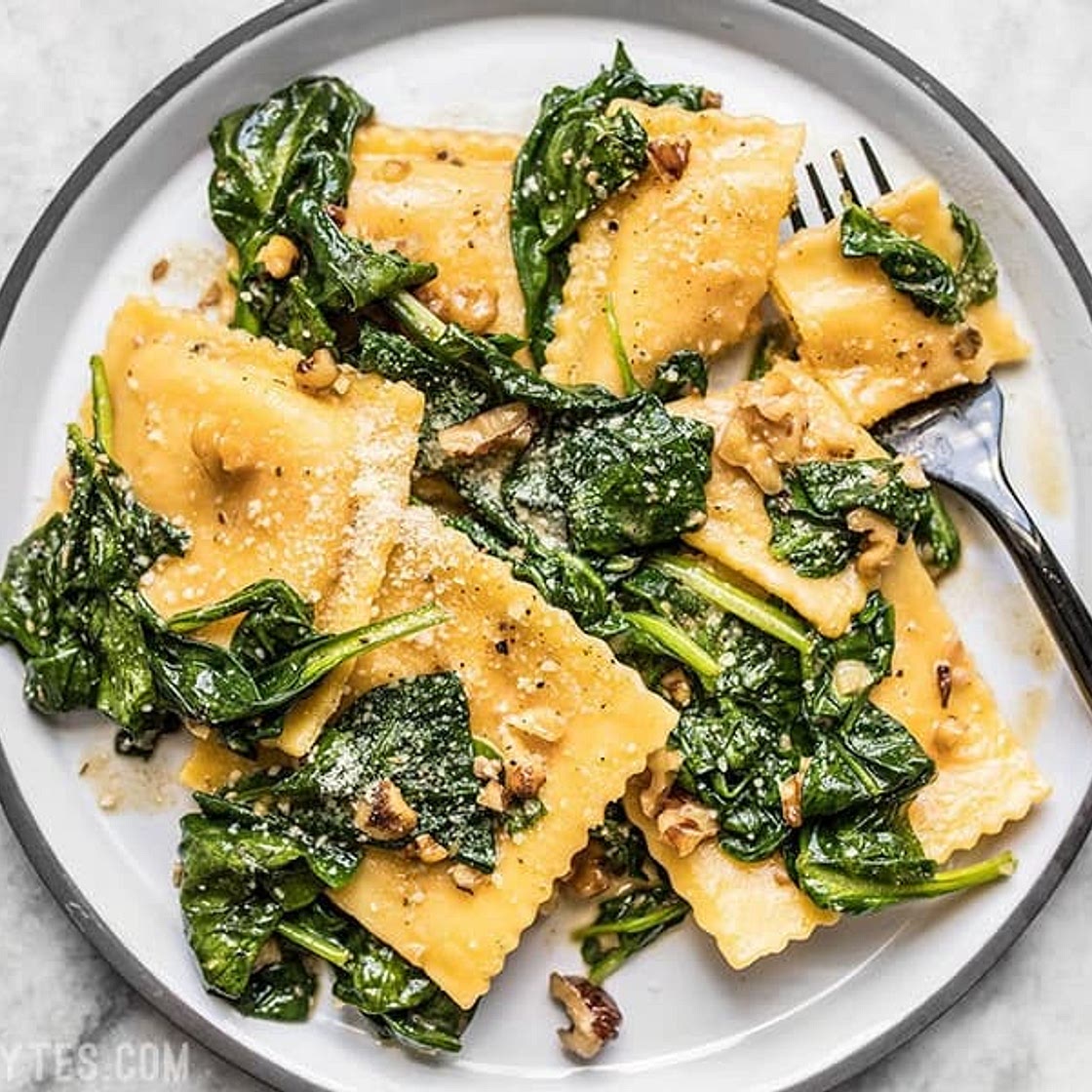 Ravioli with Sage Brown Butter Sauce, Spinach, and Walnuts