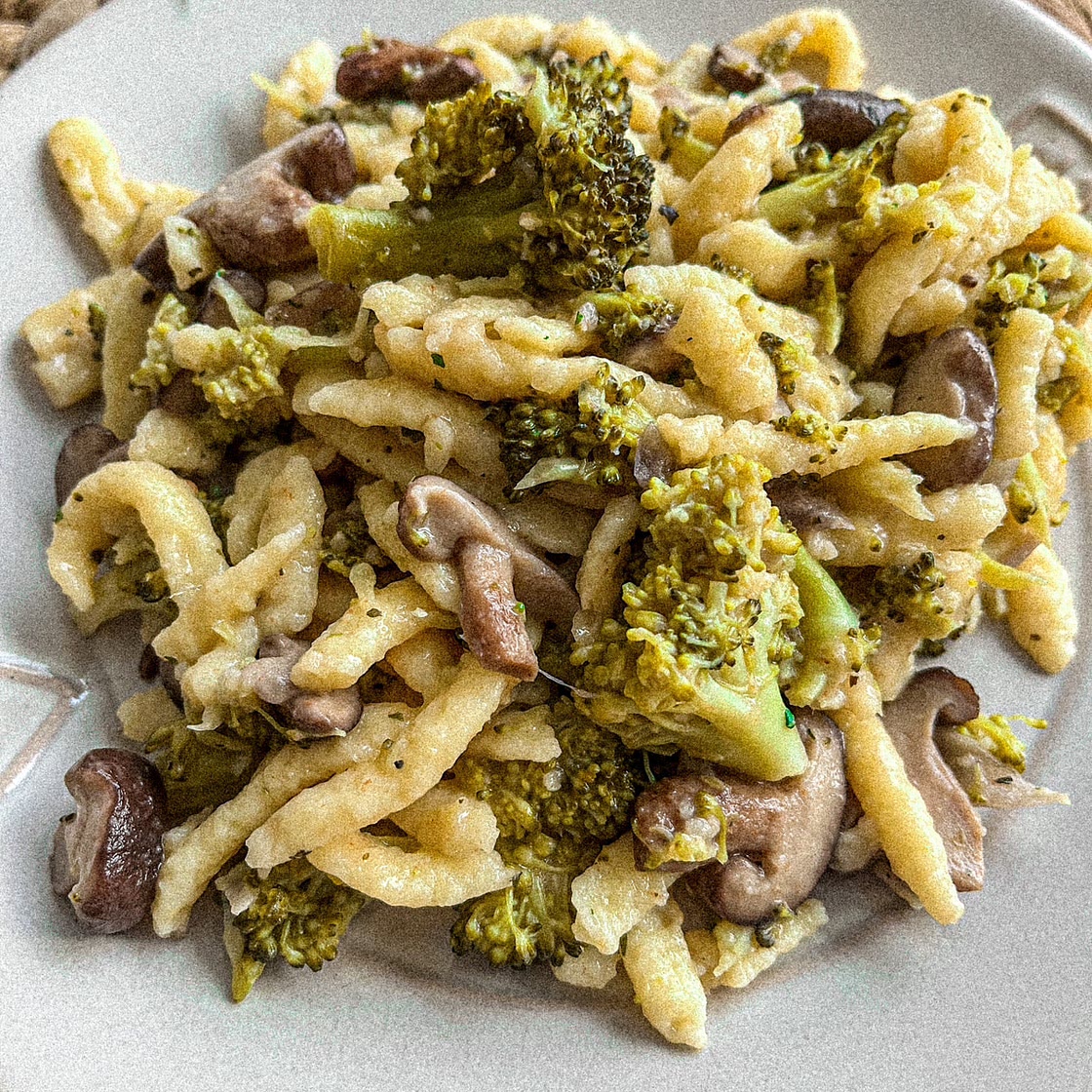 Egg Noodles (Spätzle) with shiitake mushrooms and broccoli in a cheesy sauce