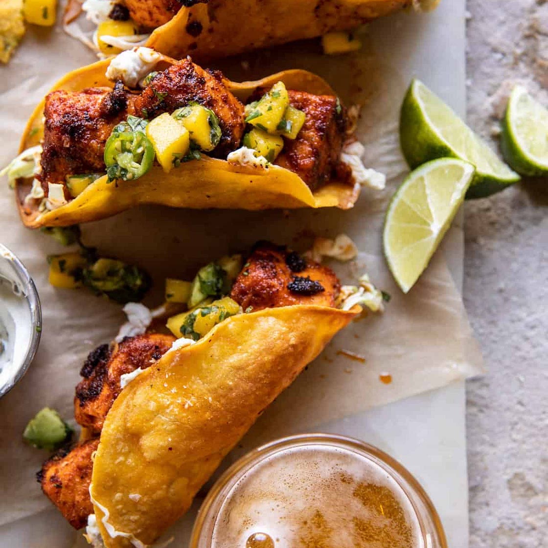 Crispy BBQ Salmon Tacos with Avocado Mango Salsa and Jalapeño Cream