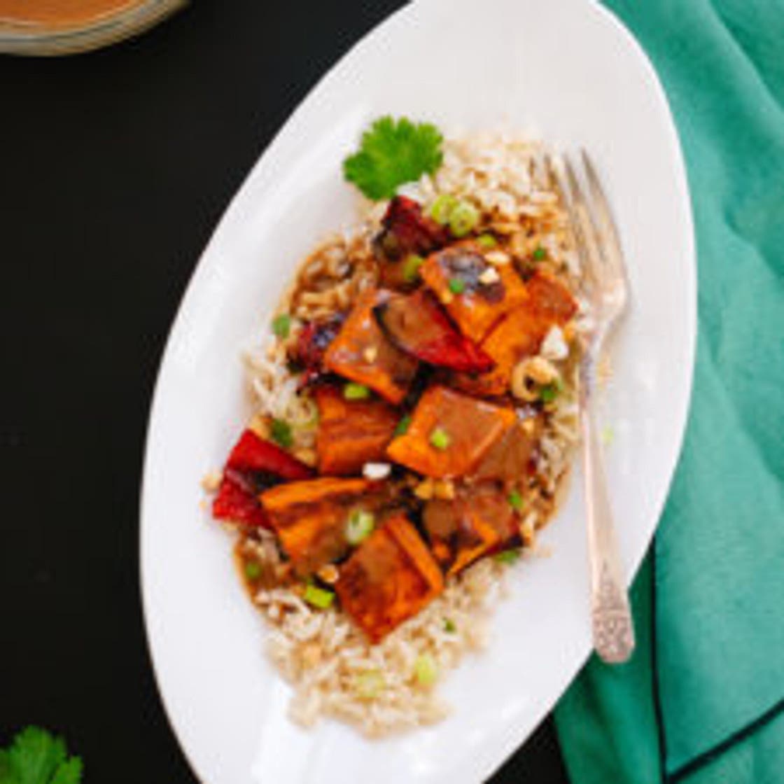 Spicy Thai Peanut Sauce over Roasted Sweet Potatoes and Rice