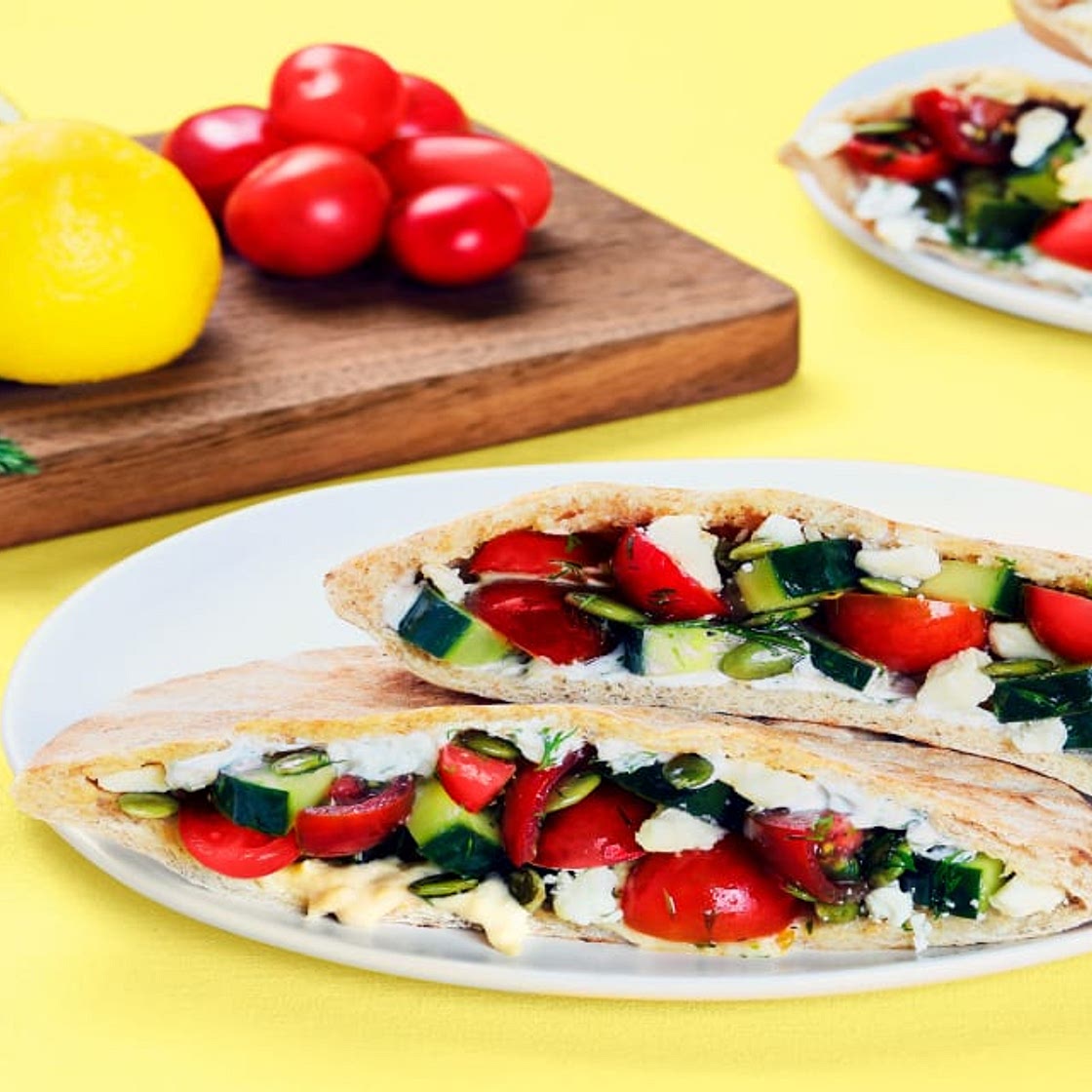 Cucumber Salad-Stuffed Pita Pockets with Hummus, Feta & Creamy Dill Sauce