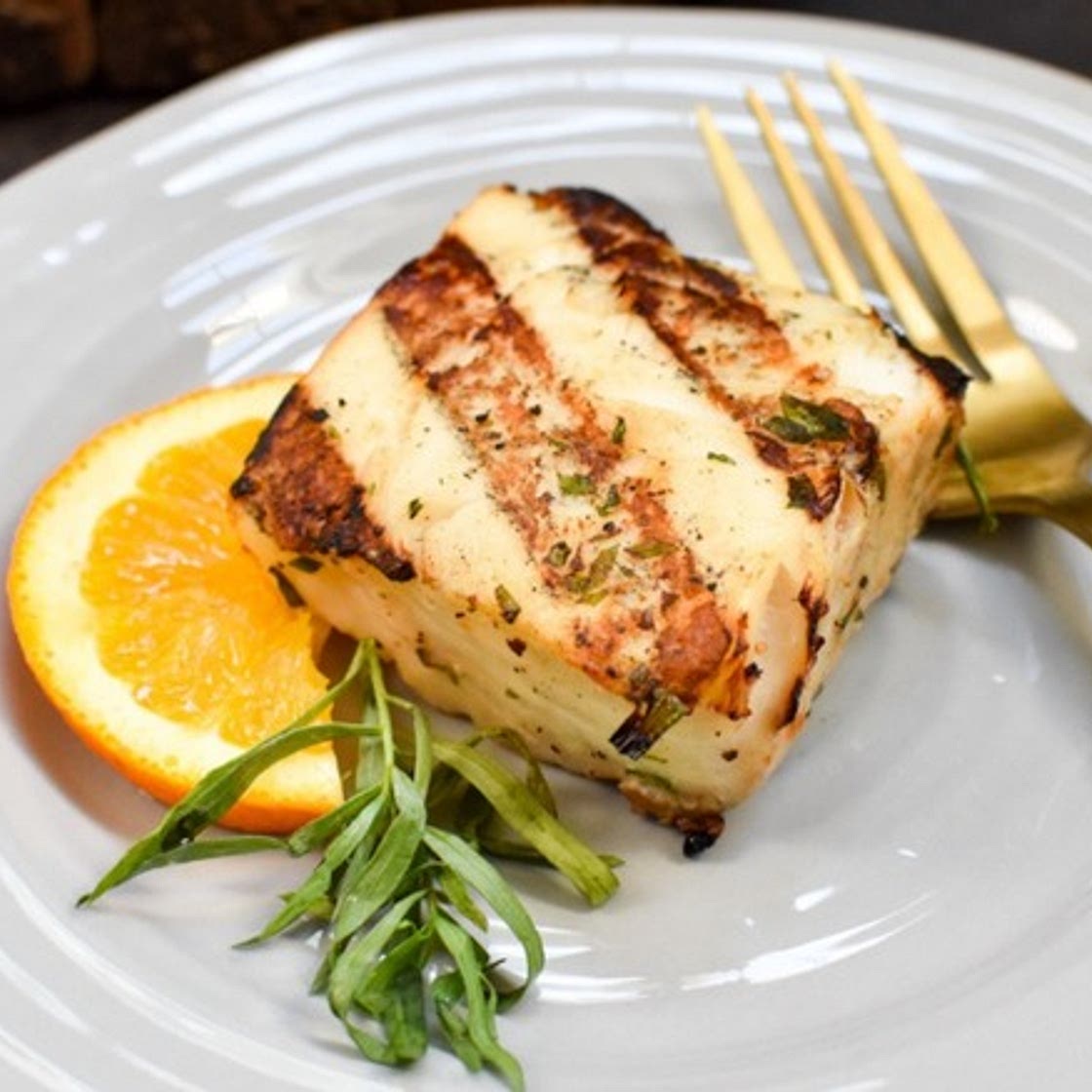 Bobby Flay's Grilled Halibut Recipe With A Twist