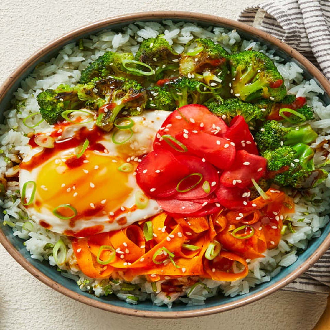 Broccoli-Carrot Donburi with a Fried Egg over Scallion Lime Rice with Pickled Radishes & Sesame Seeds