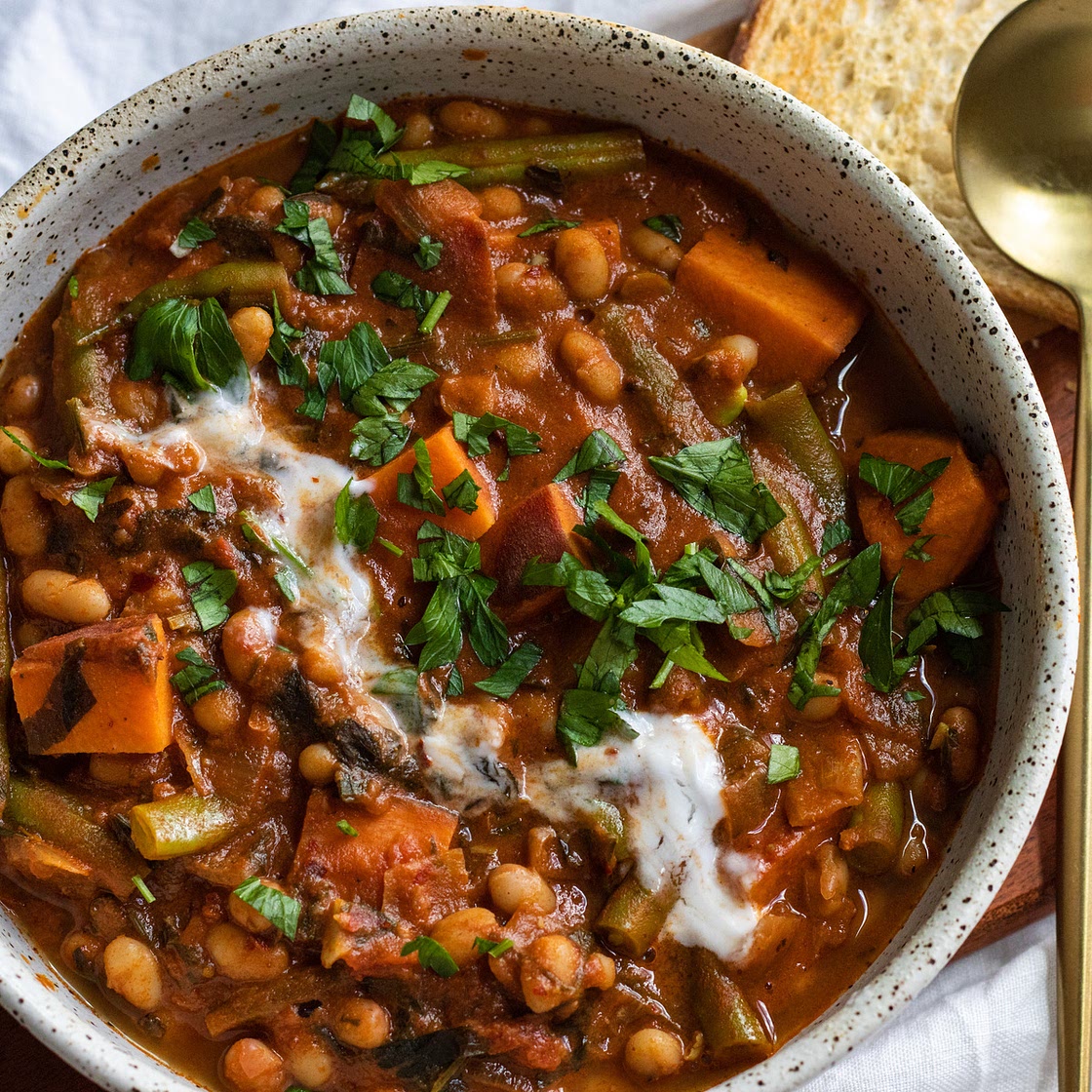 sweet potato and white bean stew with harissa and tahini (vegan)