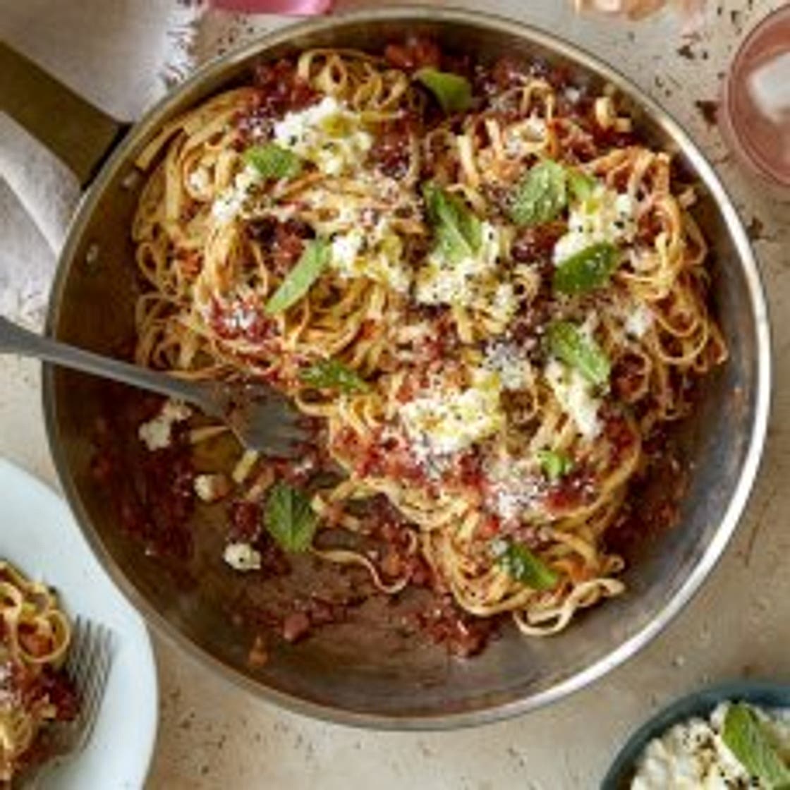 Maccheroni alla chitarra with fresh tomato sauce, anchovies, ricotta and mint