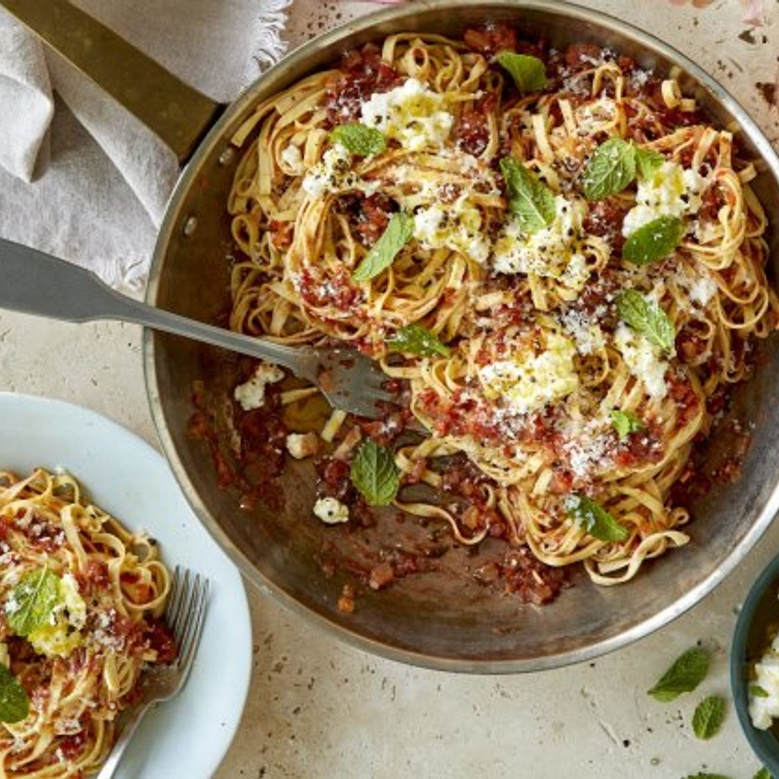 Maccheroni alla chitarra with fresh tomato sauce, anchovies, ricotta and mint