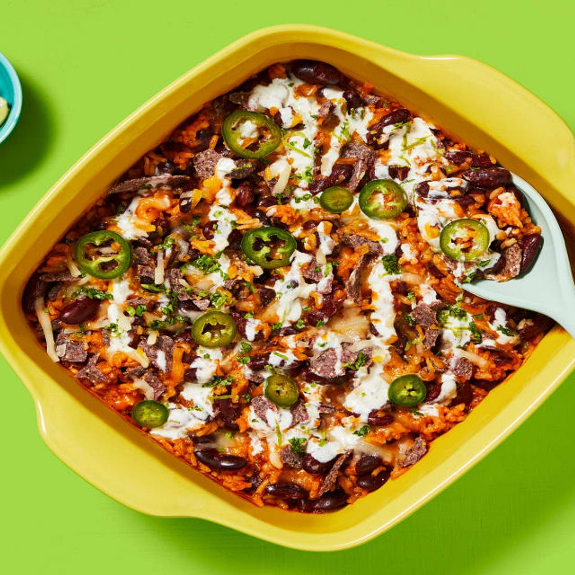 One-Pan Rice & Bean Enchilada Bake with Pickled Jalapeño, Zesty Crema & Blue Corn Tortilla Chips