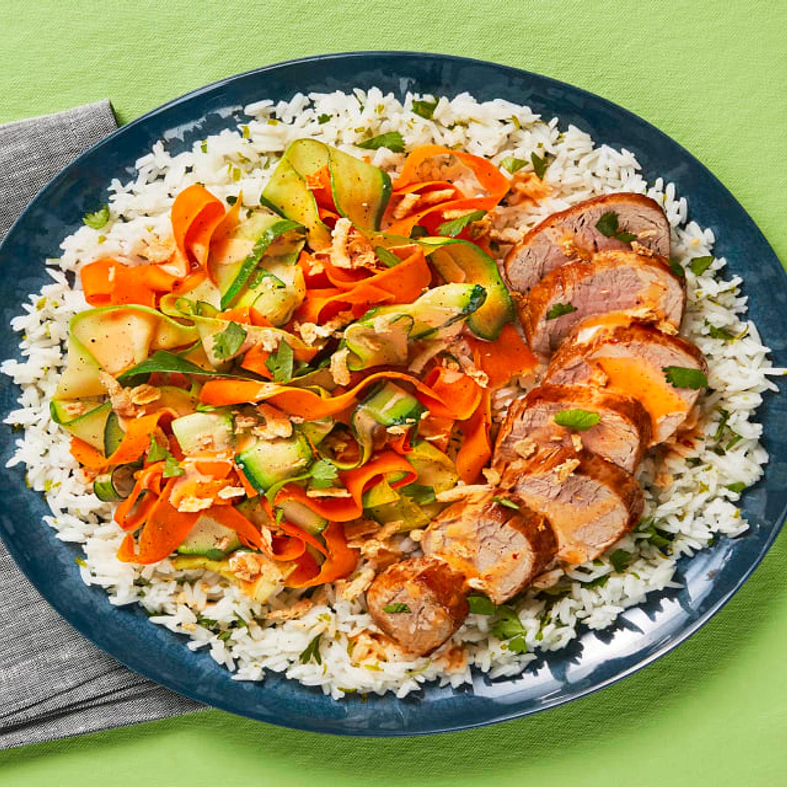 Sweet Chili Pork Tenderloin Rice Bowls with Veggie Ribbons, Cilantro & Crispy Onions