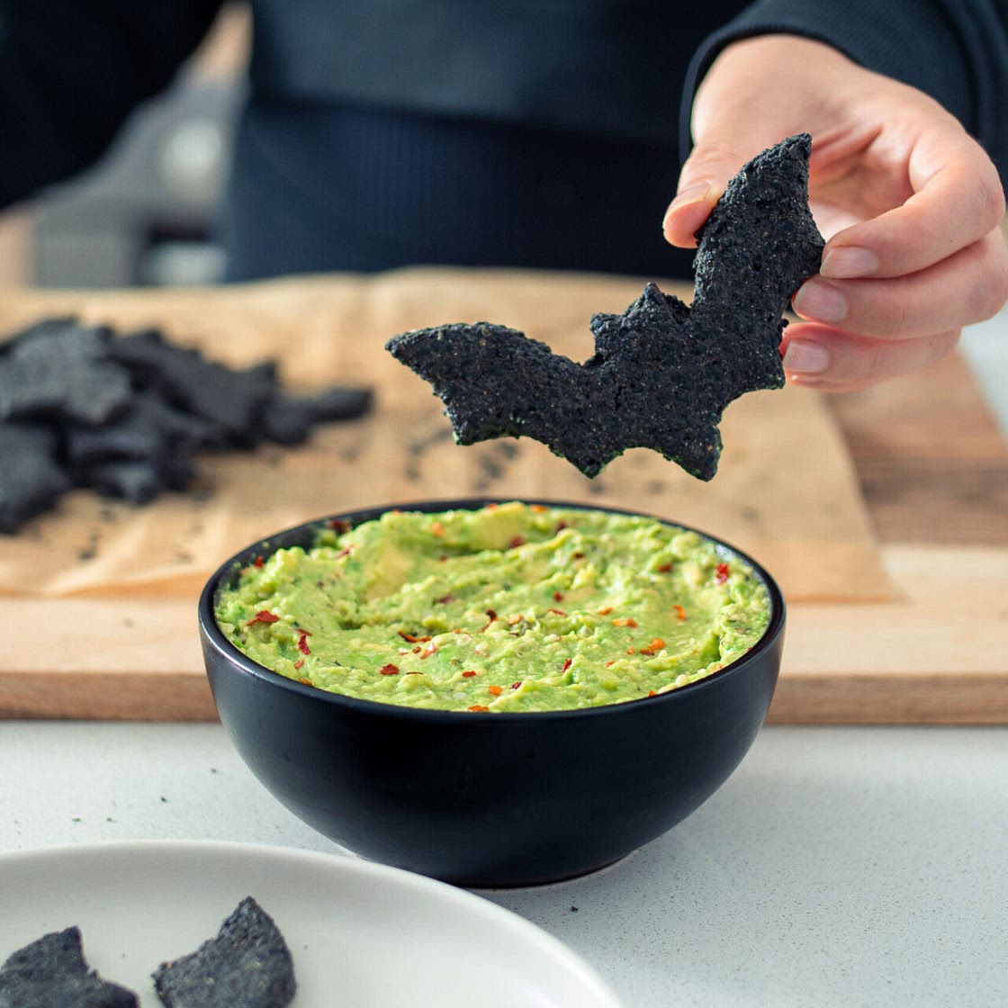 Bat-Shaped Halloween Crackers with Guacamole