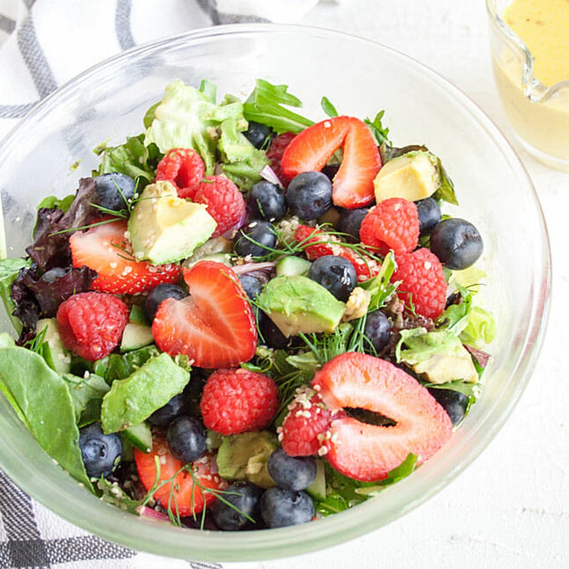 Avocado and Berry Salad with Turmeric Tahini Dressing