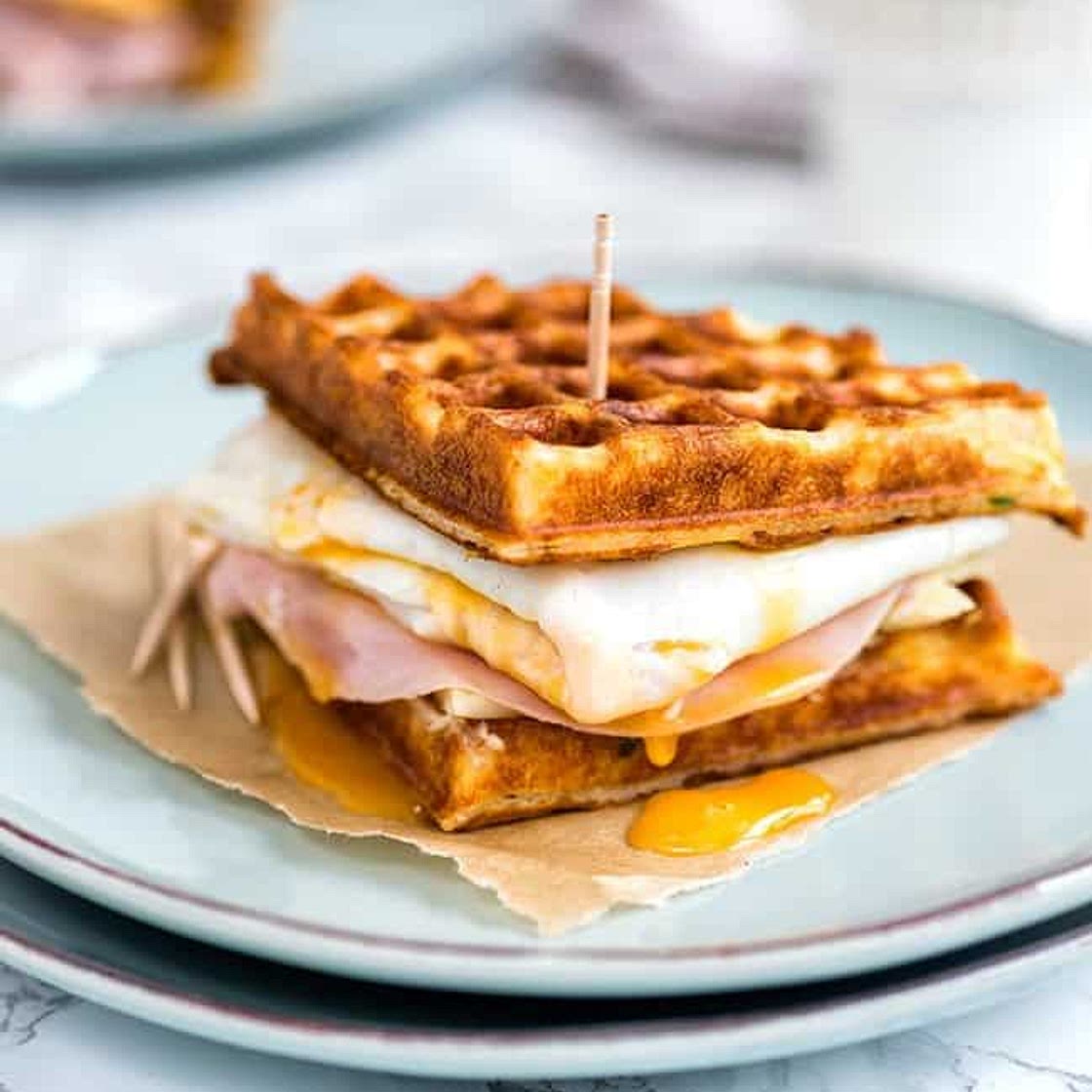 Parmesan waffle, ham, cheese and egg breakfast sandwich