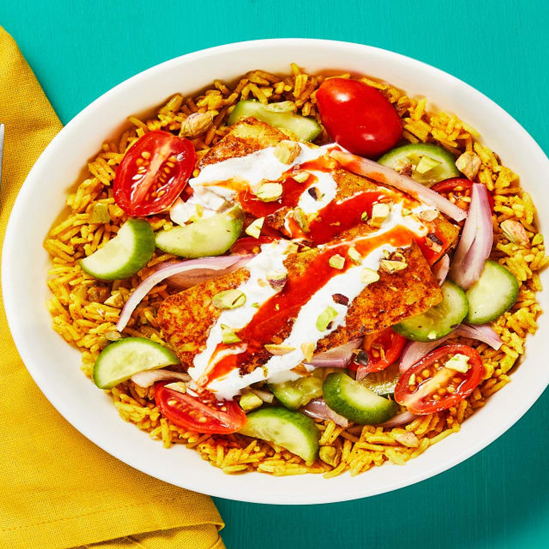 Shawarma-Spiced Halloumi with Pistachio Rice, Garlicky White Sauce & Israeli Salad